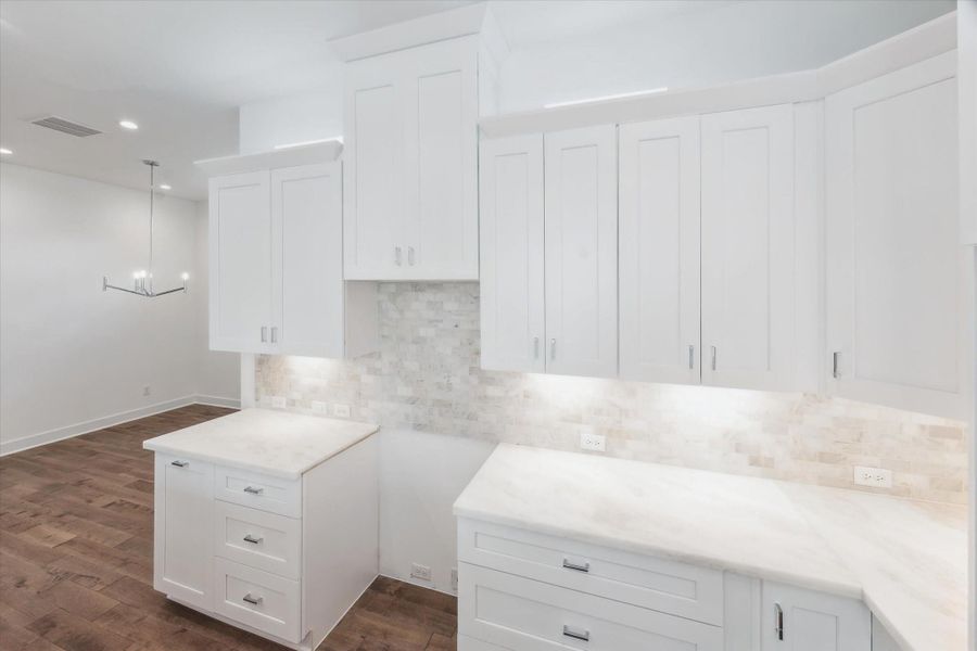 Cabinets to the Ceiling * Marble Backsplash * Marble Counters * Lots of Cabinets and Drawers. Cabinets to the Ceiling * Marble Backsplash * Marble Counters * Lots of Cabinets and Drawers.