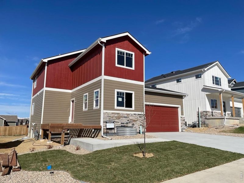 Front exterior of a new home in , Severance, CO, highlighting curb appeal (Image 2). Front exterior of a new home in , Severance, CO, highlighting curb appeal (Image 2).