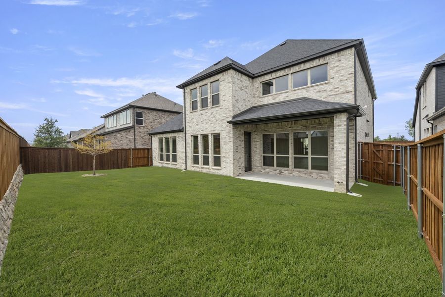 Exterior details and patio area of a home in Nelson Lake Estates, Rockwall (Image 22).