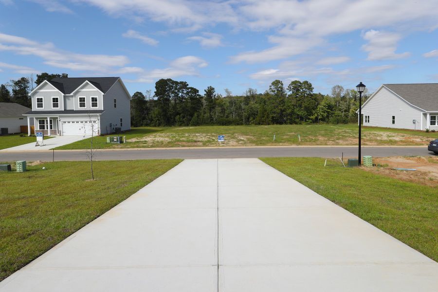 Front exterior of a new home in Jordan Grove, Conway, SC, highlighting curb appeal (Image 23).