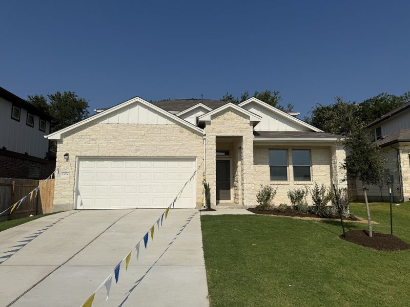 Front exterior of a new home in The Hills of Bear Creek, Austin, TX, highlighting curb appeal (Image 4).