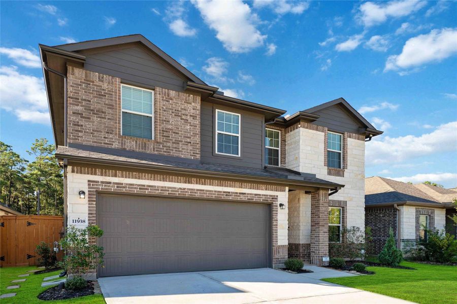 Thoughtful details like the epoxy-coated garage floor, decorative address block, and exterior lighting complete the polished first impression. Thoughtful details like the epoxy-coated garage floor, decorative address block, and exterior lighting complete the polished first impression.