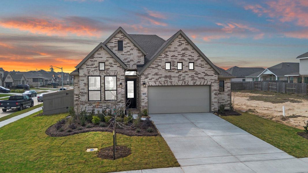 Front exterior of a new home in Artavia, Conroe, TX, highlighting curb appeal (Image 21). Front exterior of a new home in Artavia, Conroe, TX, highlighting curb appeal (Image 21).