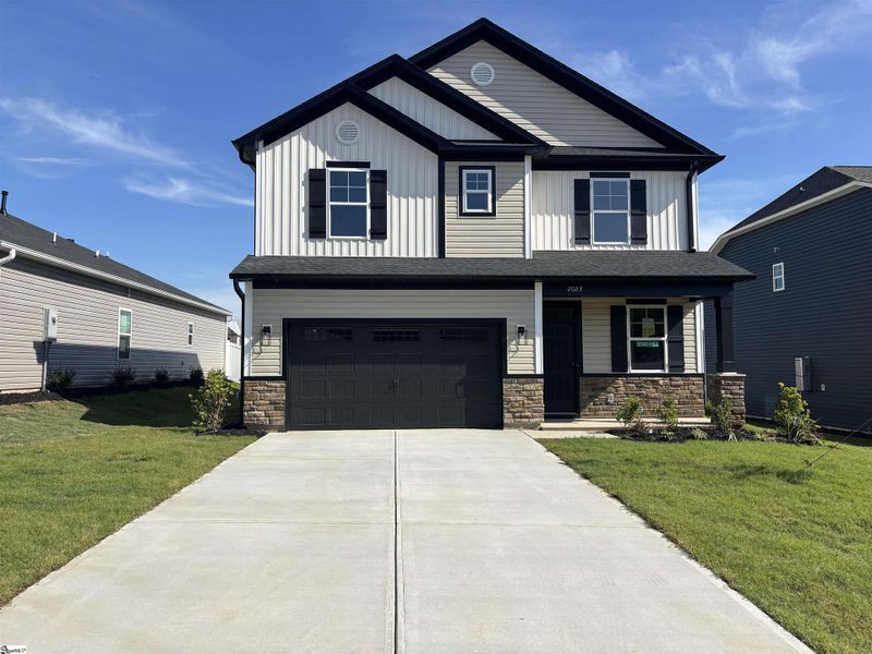 Front exterior of a new home in Halton Oaks, Spartanburg, SC, highlighting curb appeal (Image 18).
