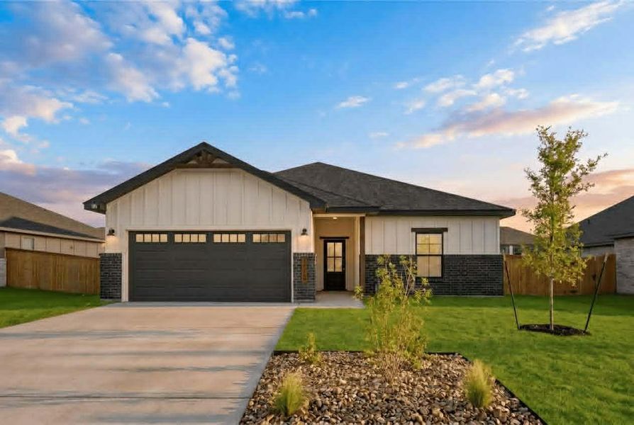 A modern farmhouse facade with board and batten siding welcomes you home. A modern farmhouse facade with board and batten siding welcomes you home.