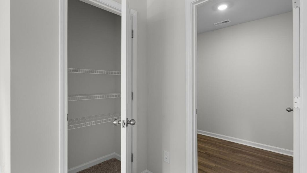 Representative unfurnished interior of a home built from the WOODSTOCK by D.R. Horton in Surfside Landing, Hubert (Image 32).