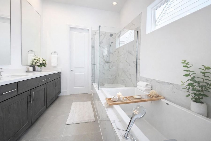 Frameless shower door, 6' tub, (not freestanding), and separate toilet room.Similar plan and finishes.