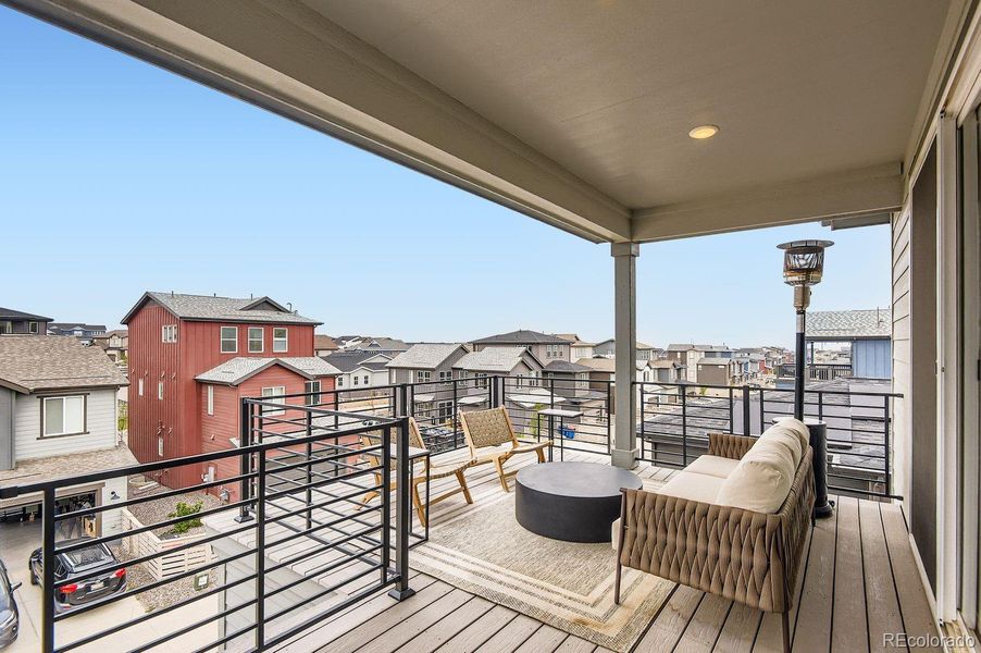 A spacious, well-appointed balcony extends from the third-level living room, providing the perfect space for relaxing, entertaining, and enjoying Colorado’s outdoor lifestyle.