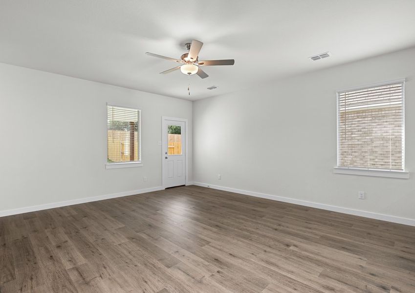 The living room has a large window that lets in great, natural light.