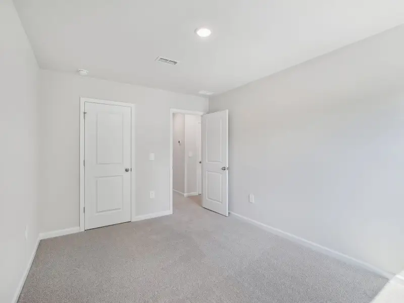 Spacious, unfurnished interior of a new home in The Rows at Buffaloe Reserve, Raleigh (Image 18). Spacious, unfurnished interior of a new home in The Rows at Buffaloe Reserve, Raleigh (Image 18).