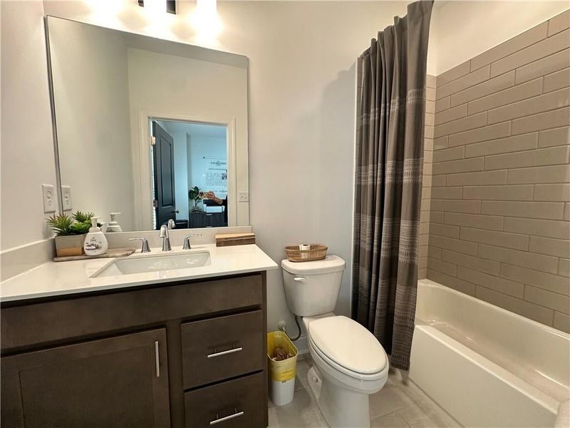 Full bathroom in Guest Bedroom #1 on Terrace Level *Images shown are from a decorated model of the same floor plan. Design selections and color packages will vary by home.* Full bathroom in Guest Bedroom #1 on Terrace Level *Images shown are from a decorated model of the same floor plan. Design selections and color packages will vary by home.*