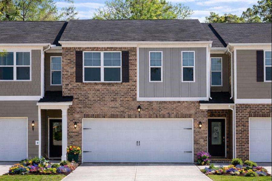 Front exterior of a new home in The Enclave at Whitewater Creek, Union City, GA, highlighting curb appeal (Image 21). Front exterior of a new home in The Enclave at Whitewater Creek, Union City, GA, highlighting curb appeal (Image 21).