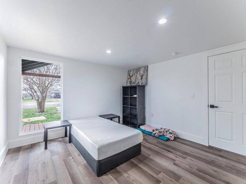 Bedroom featuring light wood-type flooring and recessed lighting