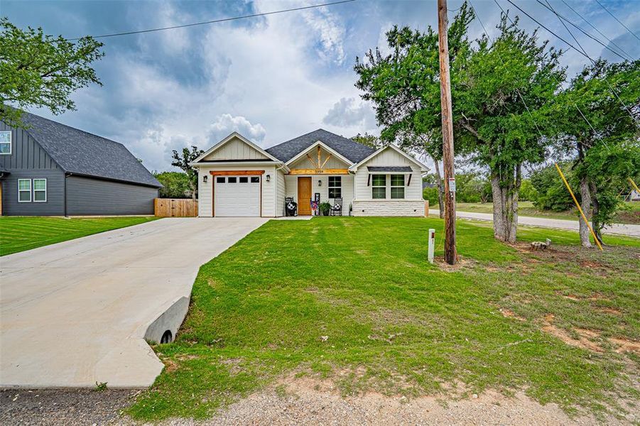 Front exterior of a new home in , Granbury, TX, highlighting curb appeal (Image 2). Front exterior of a new home in , Granbury, TX, highlighting curb appeal (Image 2).