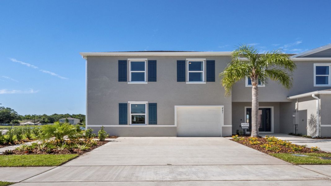 Front exterior of a new home in Rivers Edge, Edgewater, FL, highlighting curb appeal (Image 1). Front exterior of a new home in Rivers Edge, Edgewater, FL, highlighting curb appeal (Image 1).