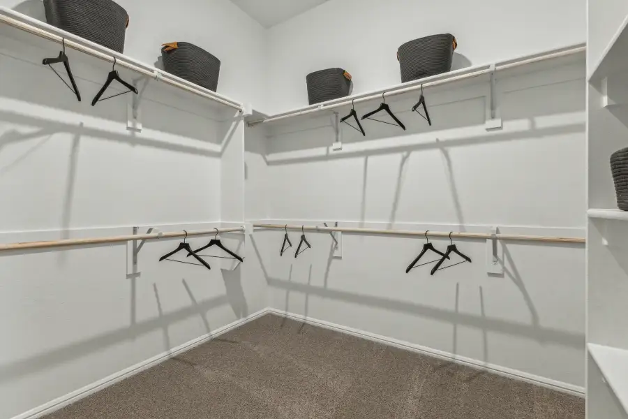 Primary Closet in the Turquoise home plan by Trophy Signature Homes – REPRESENTATIVE PHOTO Primary Closet in the Turquoise home plan by Trophy Signature Homes – REPRESENTATIVE PHOTO