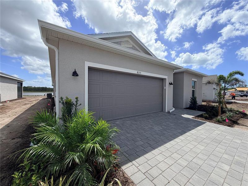 Front exterior of a new home in , Englewood, FL, highlighting curb appeal (Image 14).