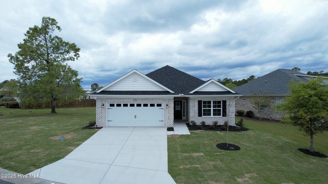 Front exterior of a new home in Palmetto Creek, Bolivia, NC, highlighting curb appeal (Image 1). Front exterior of a new home in Palmetto Creek, Bolivia, NC, highlighting curb appeal (Image 1).