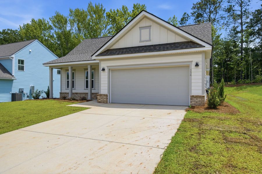 Front exterior of a new home in Carriage Estates, Lexington, SC, highlighting curb appeal (Image 1). Front exterior of a new home in Carriage Estates, Lexington, SC, highlighting curb appeal (Image 1).