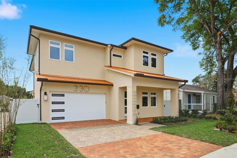 Front exterior of a new home in , Orlando, FL, highlighting curb appeal (Image 2). Front exterior of a new home in , Orlando, FL, highlighting curb appeal (Image 2).