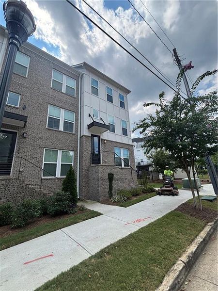 Front exterior of a new home in , Atlanta, GA, highlighting curb appeal (Image 13).