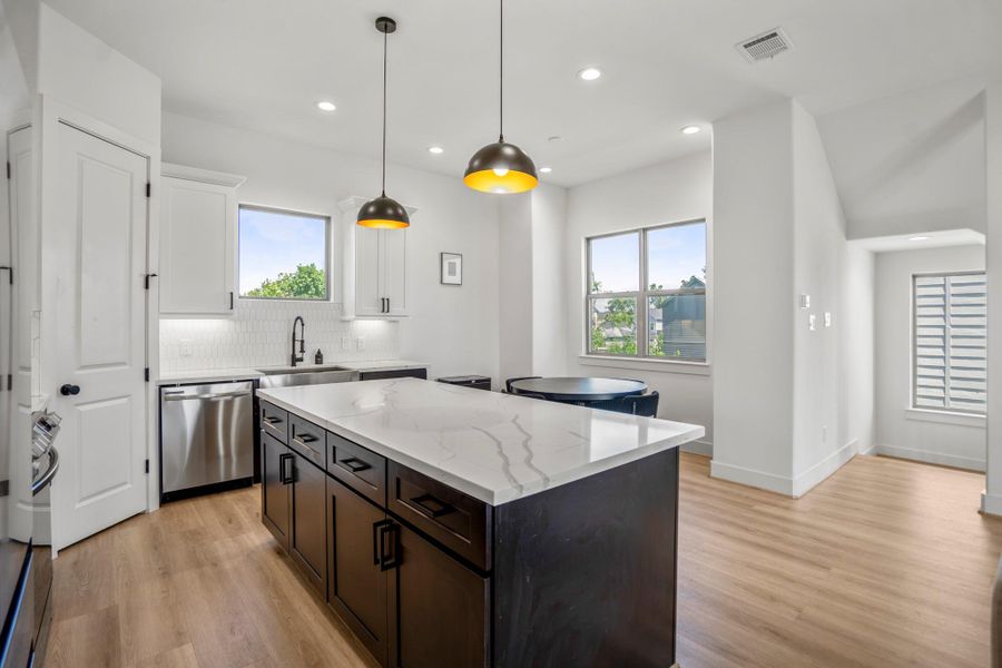 Where storage meets style—this large island keeps everything close at hand for seamless hosting.