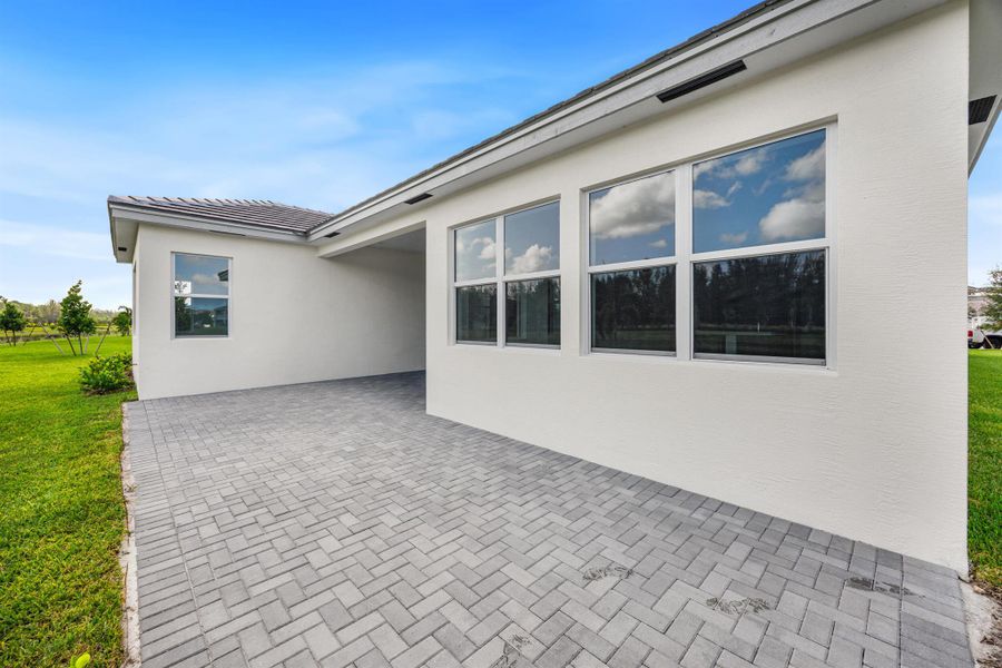 Front exterior of a new home in , Westlake, FL, highlighting curb appeal (Image 26). Front exterior of a new home in , Westlake, FL, highlighting curb appeal (Image 26).
