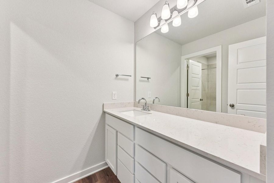 Furnished interior view inside a new home in Stallion Run, Buda (Image 14).