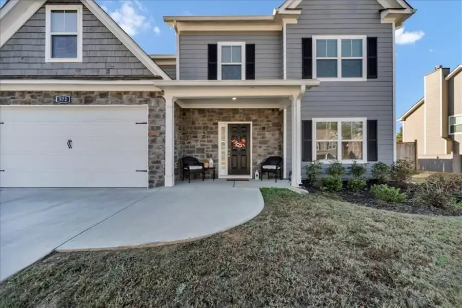 Exterior details and patio area of a home in Traditions at Cedarcrest, Dallas (Image 4).