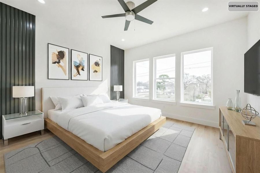 Virtually staged primary bedroom arrangement.