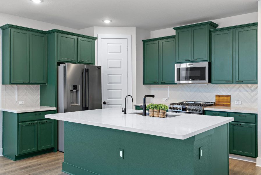 Fridge conveys with the home. Door leads to a large pantry