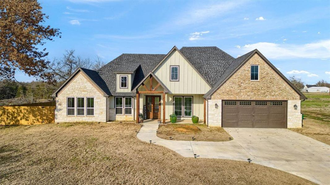 View of front of home featuring a front lawn