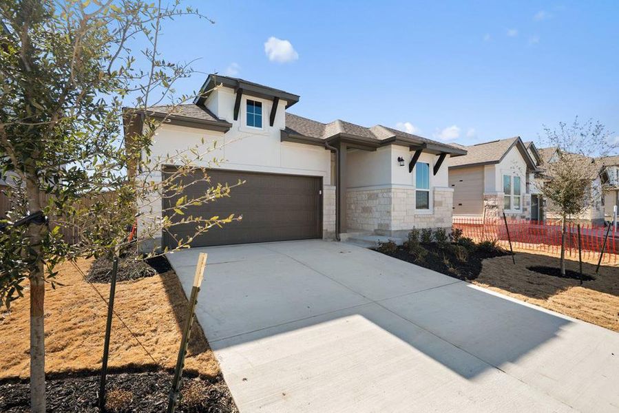 Front exterior of a new home in Park Central, Georgetown, TX, highlighting curb appeal (Image 20).