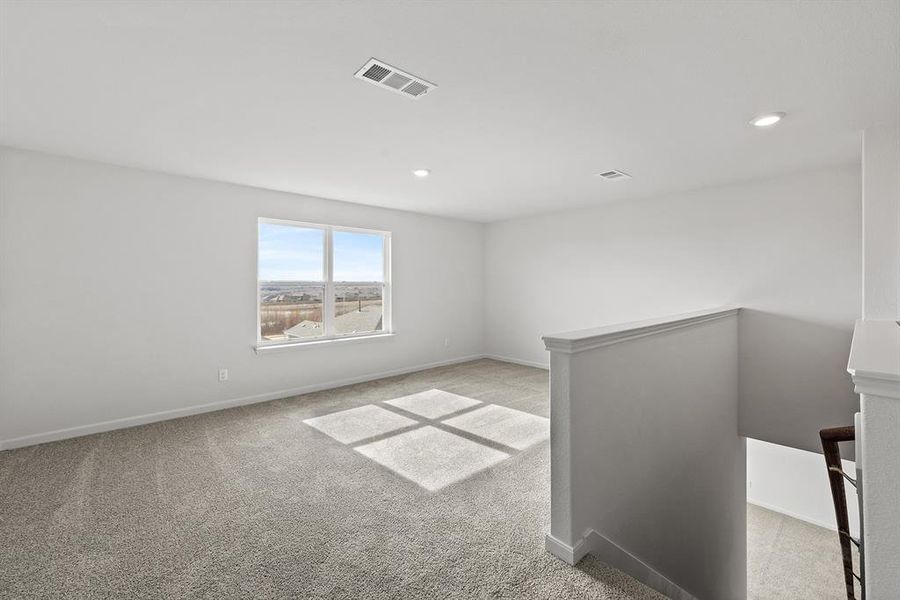 Unfurnished room with recessed lighting, visible vents, baseboards, and light colored carpet