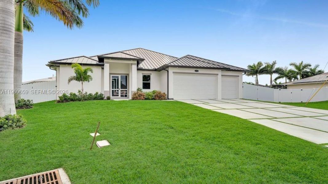 Front exterior of a new home in , Cape Coral, FL, highlighting curb appeal (Image 2). Front exterior of a new home in , Cape Coral, FL, highlighting curb appeal (Image 2).