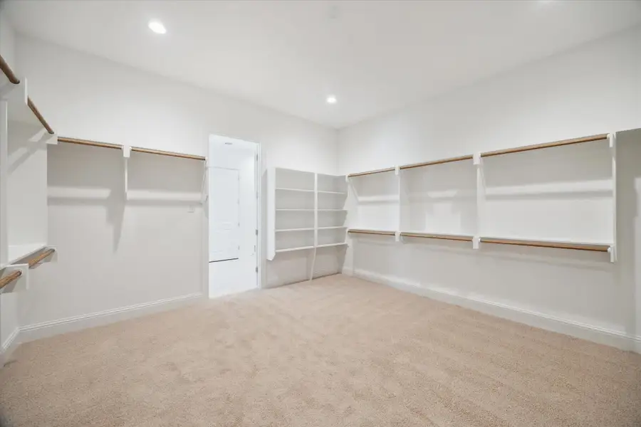 Primary Suite has a walk-in closet, with direct access to the Utility Room - so convenient!