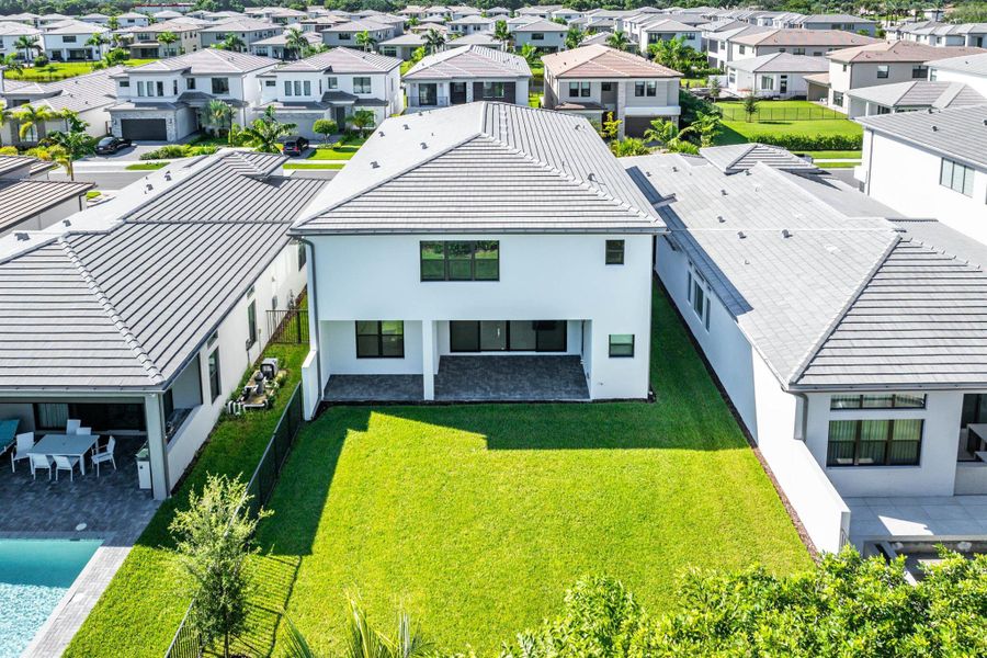 Front exterior of a new home in Lotus Edge, Boca Raton, FL, highlighting curb appeal (Image 32).