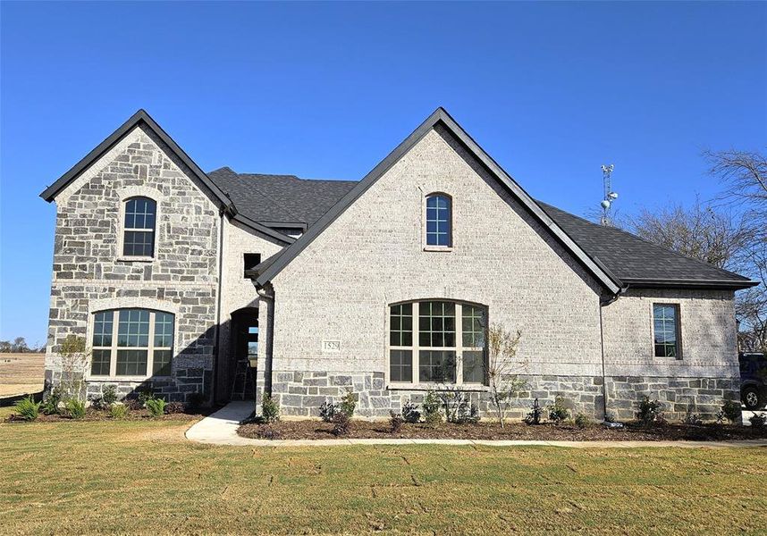 Front exterior of a new home in Corner Stone Ranch, Howe, TX, highlighting curb appeal (Image 1).