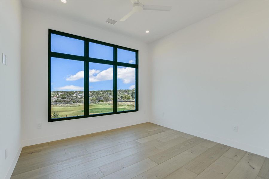 Empty room with light wood-style flooring, a ceiling fan, and recessed lighting