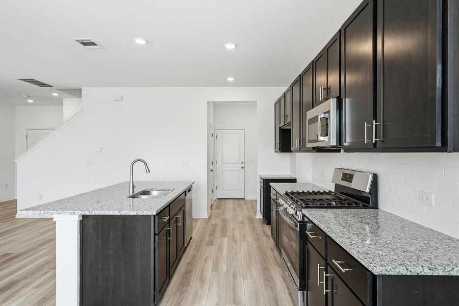 Furnished interior view inside a new home in Longview, Del Valle (Image 7).