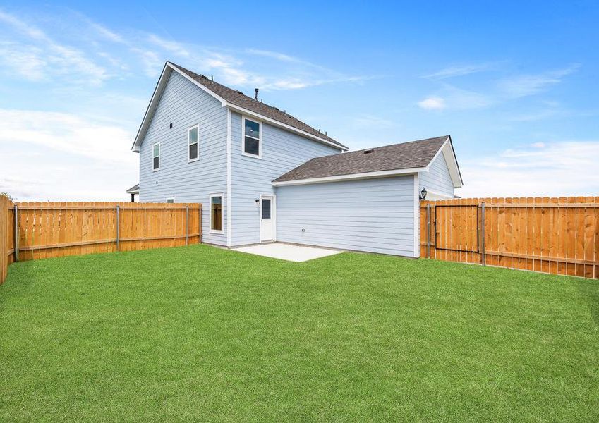 The back yard of the Camelia is fully fenced in and has a patio space.