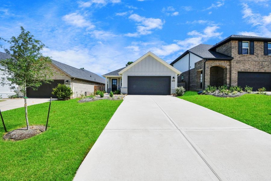 Front exterior of a new home in Montgomery Ridge: Landmark Collection, Montgomery, TX, highlighting curb appeal (Image 1). Front exterior of a new home in Montgomery Ridge: Landmark Collection, Montgomery, TX, highlighting curb appeal (Image 1).