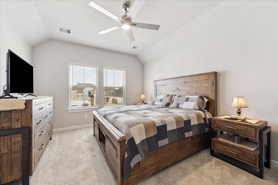 “Charming bedroom with ample natural light from dual windows and a warm, inviting atmosphere.” “Charming bedroom with ample natural light from dual windows and a warm, inviting atmosphere.”