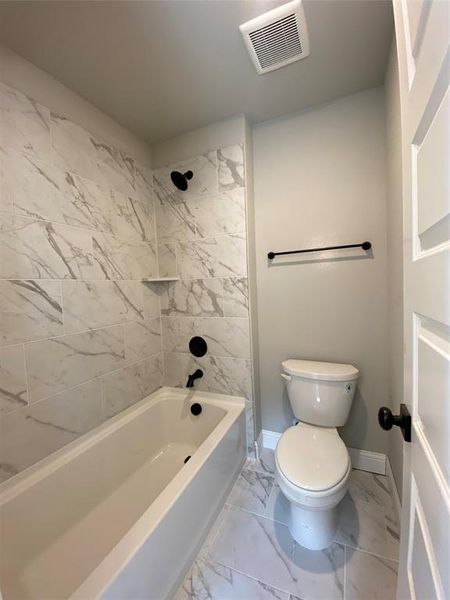 Bath 3 with separate commode and shower area and 12x24 tile makes bathroom easier to share