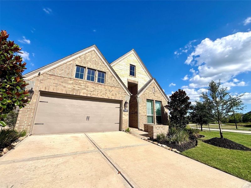 Front exterior of a new home in Bridgeland 45', Cypress, TX, highlighting curb appeal (Image 2).