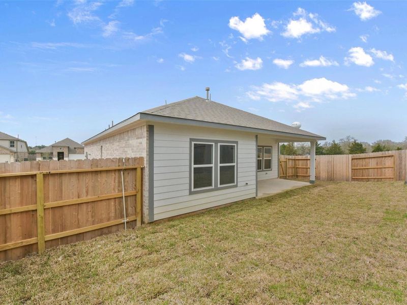 Exterior details and patio area of a home in Windmill Estates, Magnolia (Image 19). Exterior details and patio area of a home in Windmill Estates, Magnolia (Image 19).