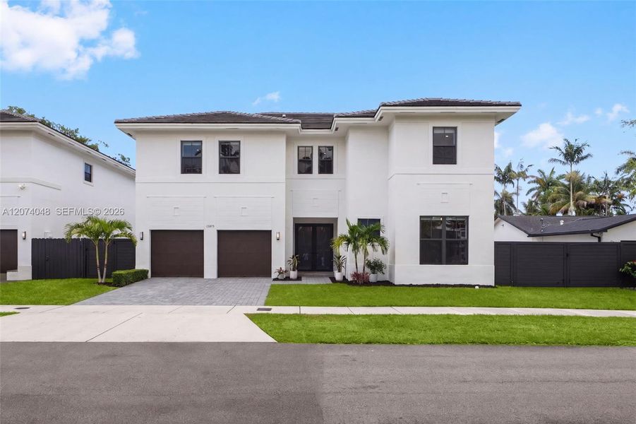 Front exterior of a new home in , Palmetto Bay, FL, highlighting curb appeal (Image 24). Front exterior of a new home in , Palmetto Bay, FL, highlighting curb appeal (Image 24).