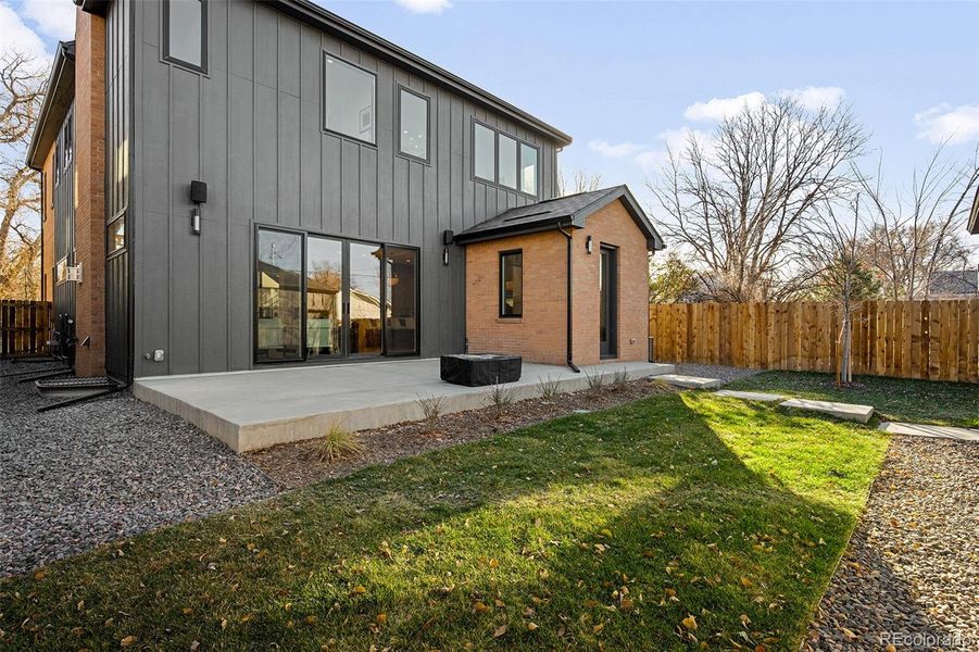 Private patio and fenced backyard