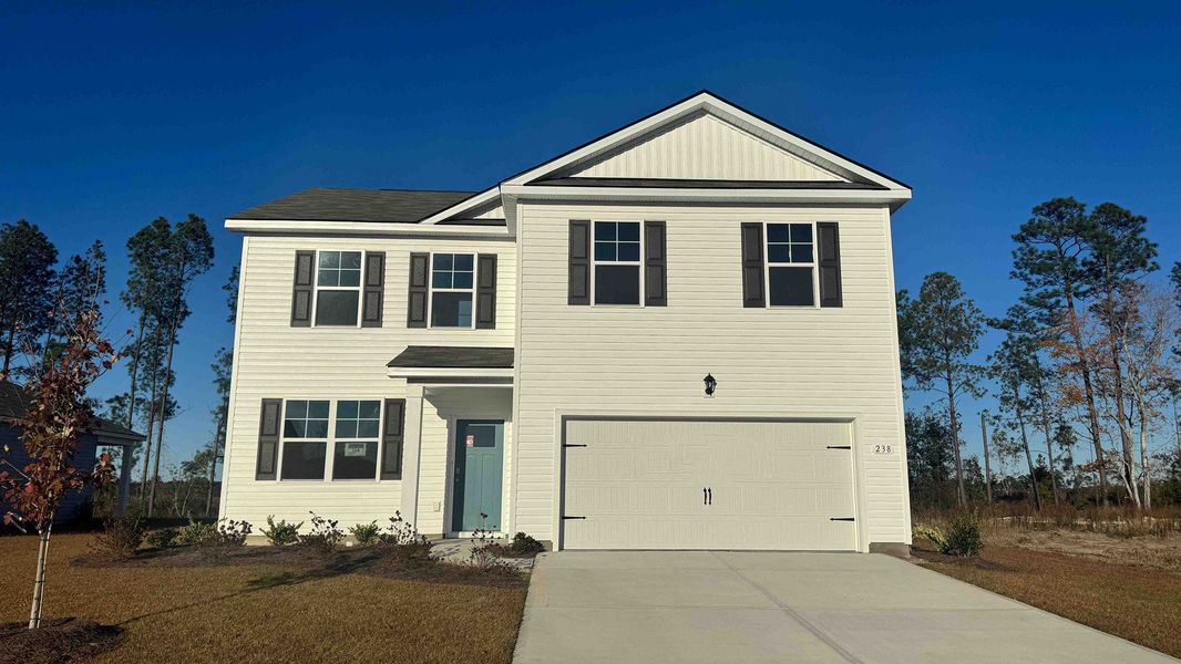 Front exterior of a new home in Preserve at Cypress Commons, Conway, SC, highlighting curb appeal (Image 1).
