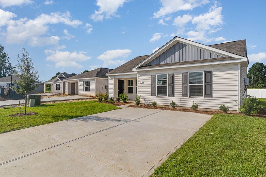 Representative exterior photo of a completed home built from the CURTIS by D.R. Horton in Auberon Woods, Conway, SC (Image 2).